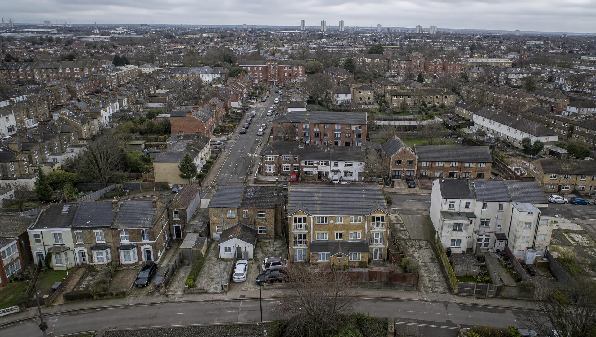 Aerial view of a dense UK residential neighbourhood illustrating scale of properties exposed to subsidence risk